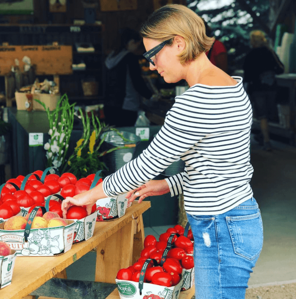 woman shopping for tomatoes