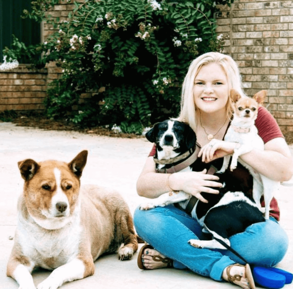 woman with three dogs