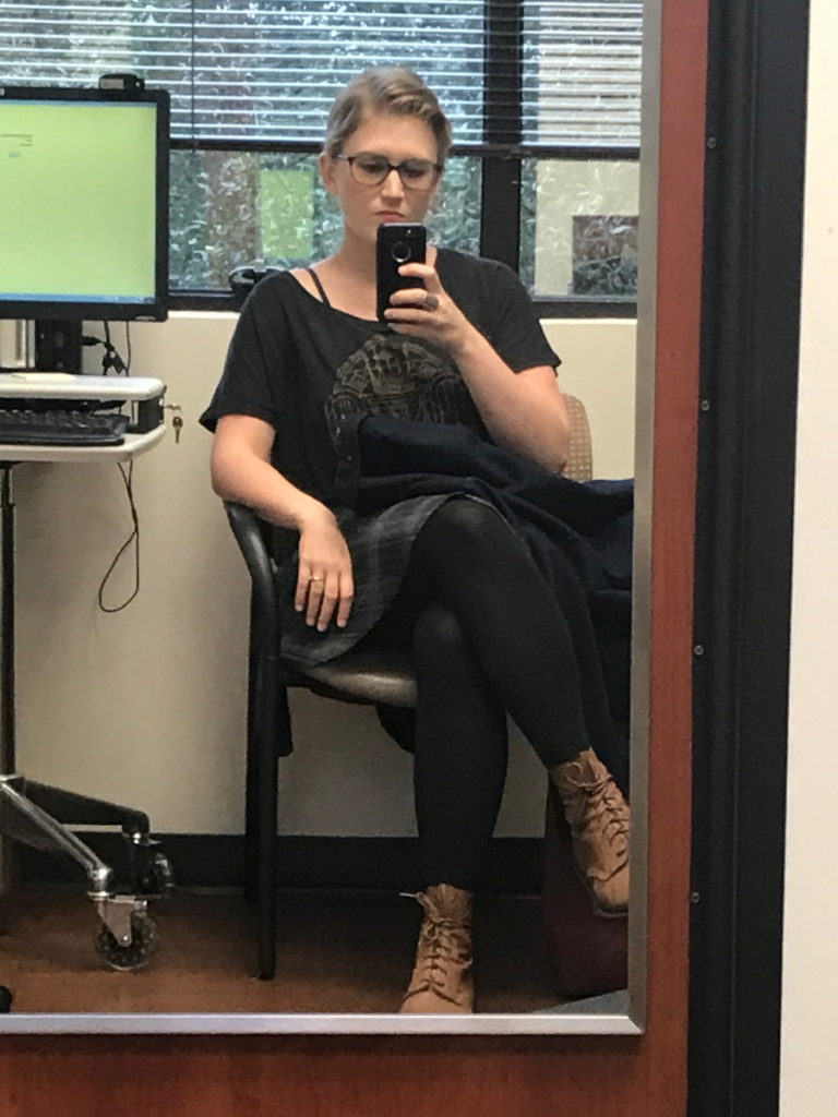 Kelsey R. taking a fashion selfie at the doctor's office