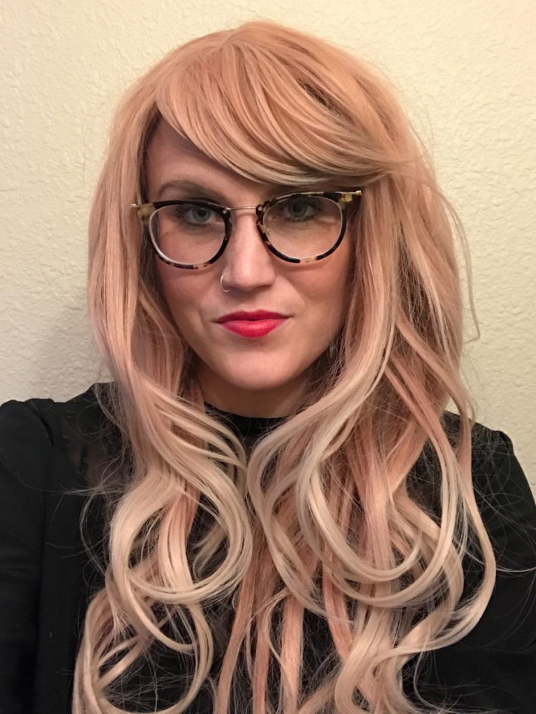 Kelsey R. wearing a long pink blonde wig