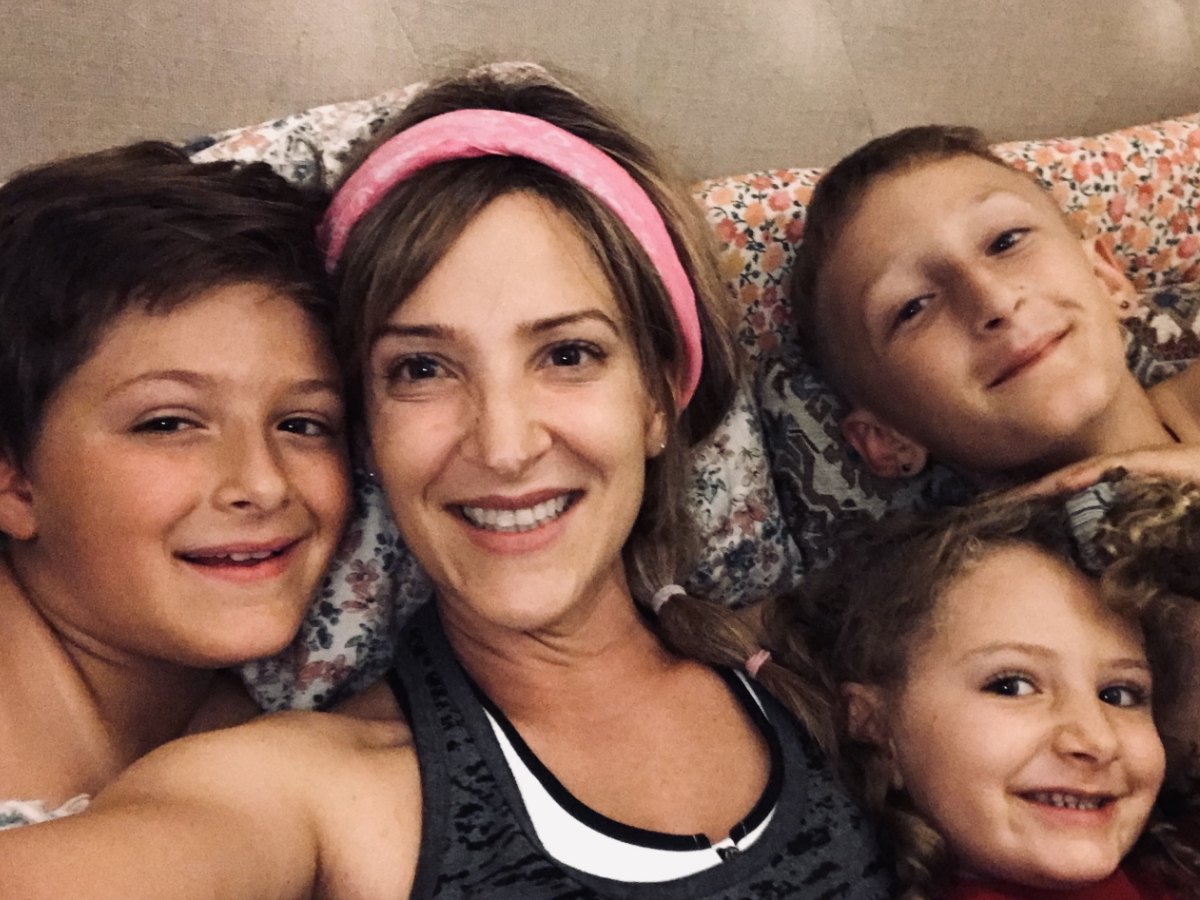 Samantha S. and kids in bed