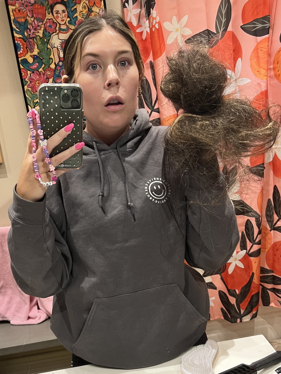 Paige C. holding hair
