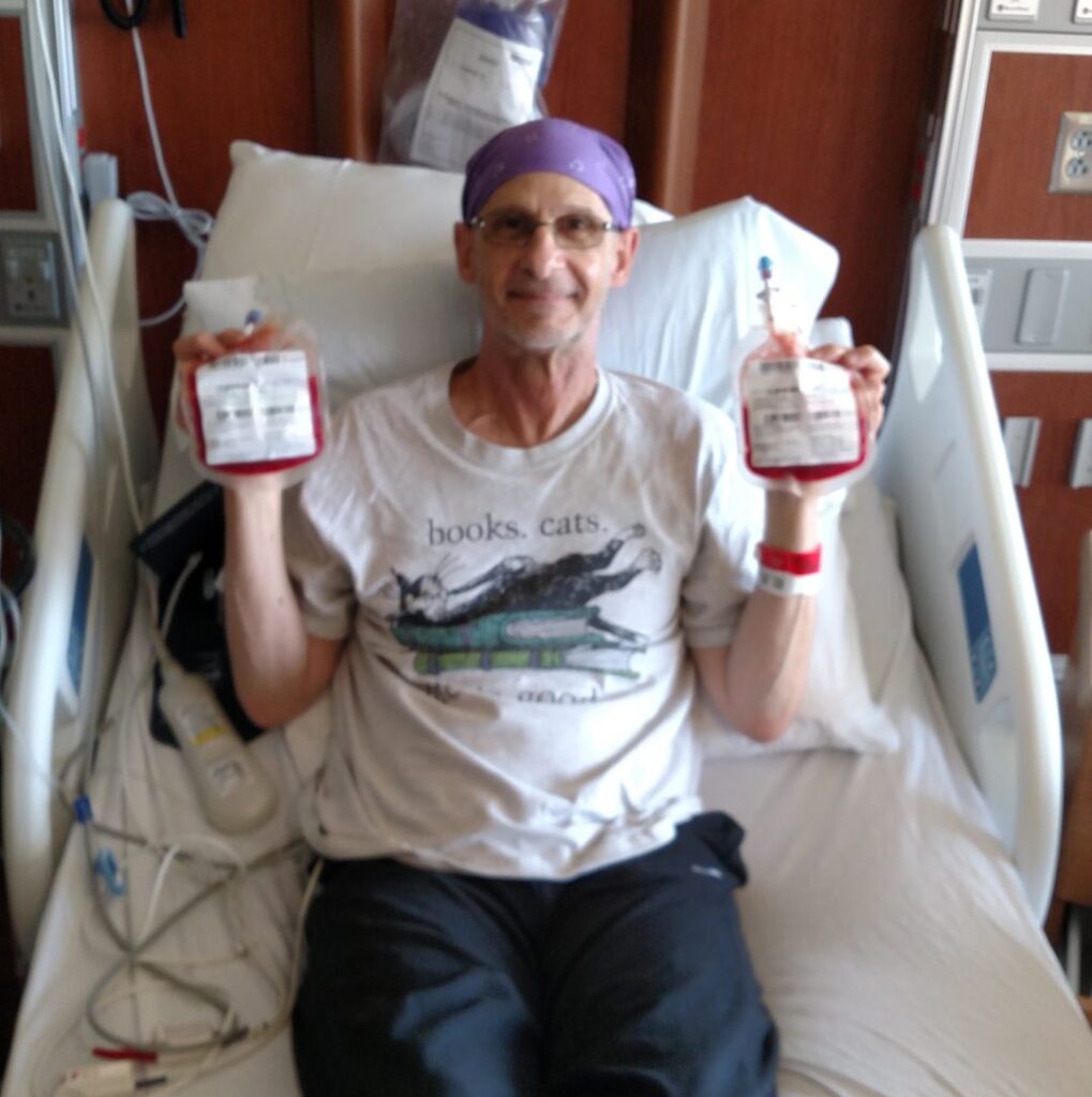 Steve holding his donor cord blood for stem cell transplant
