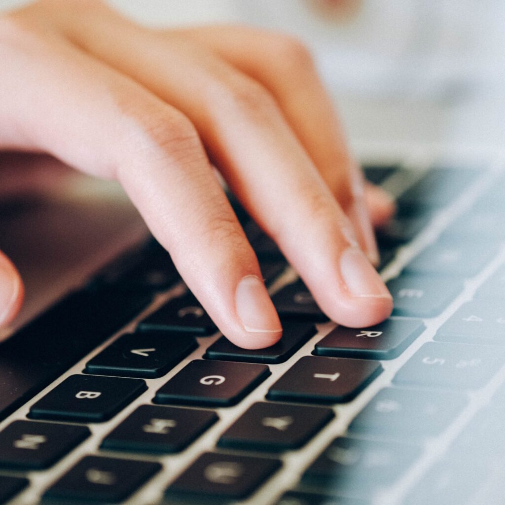 hand on laptop